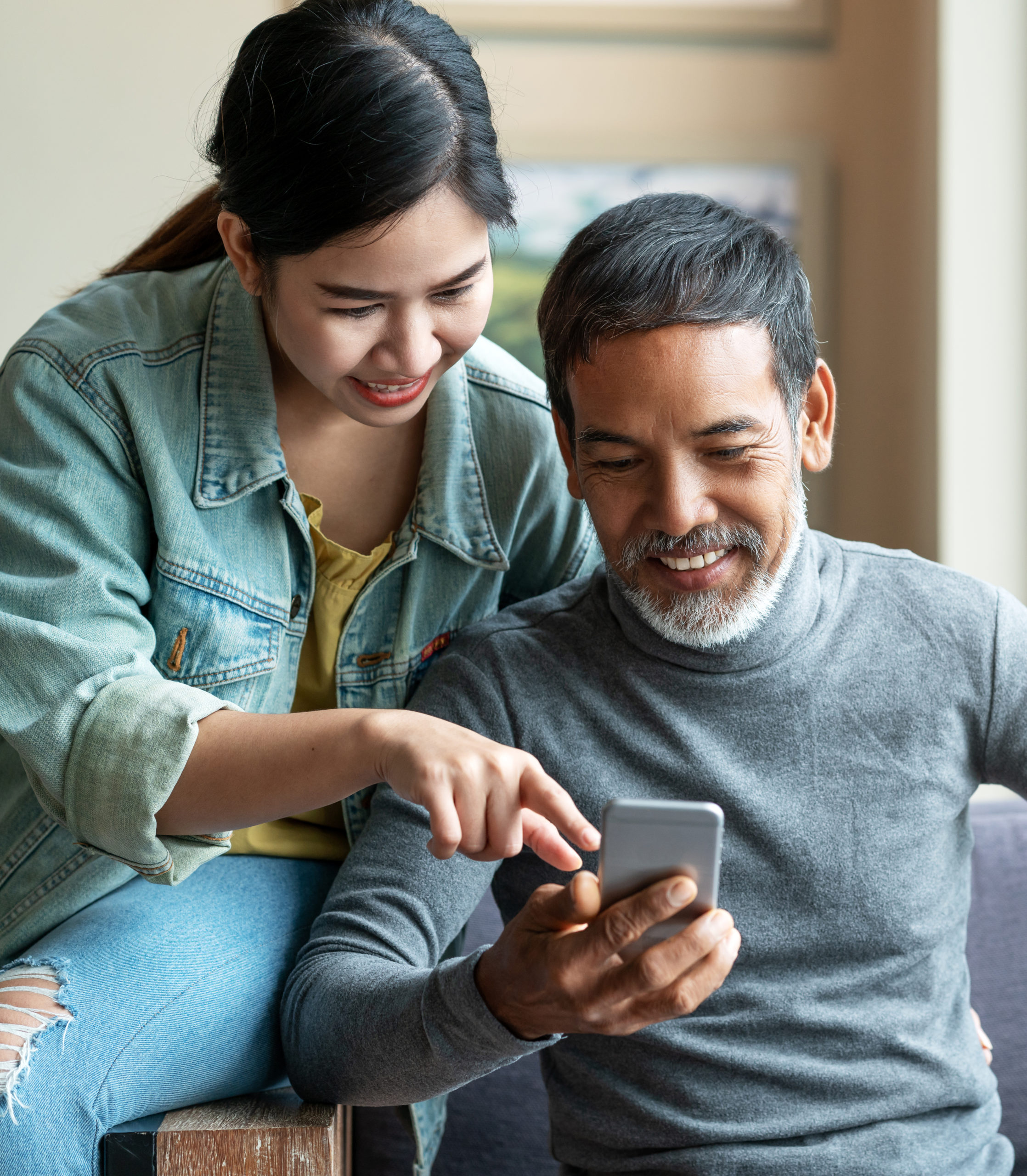 Couple looking at phone together