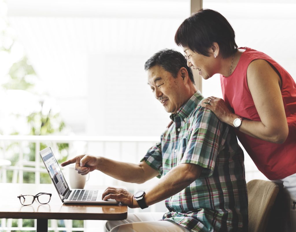 Couple looking at laptop together