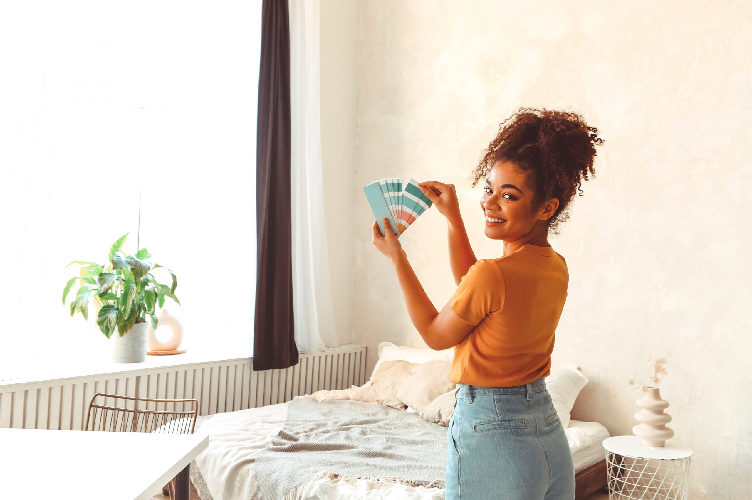 Woman holding paint swatches