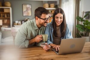 Couple looking at laptop together