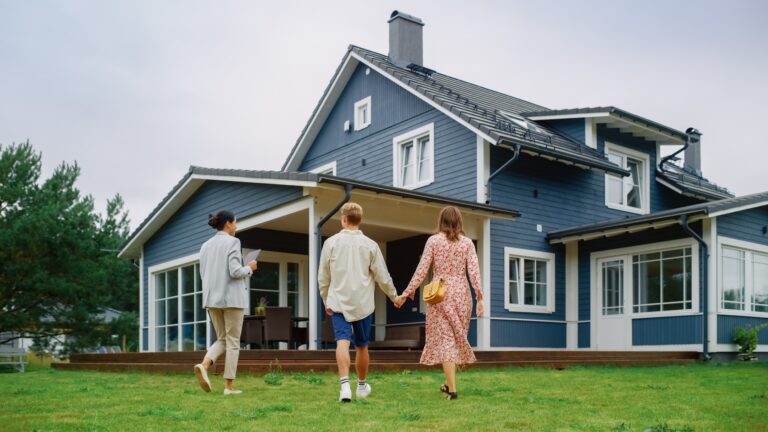 Couple looking at house with realtor