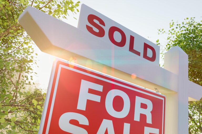 Sold sign outside house