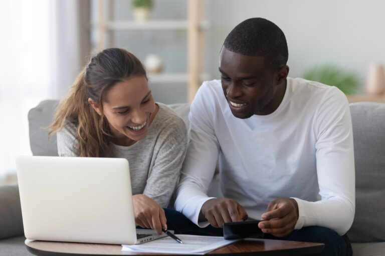Couple looking at computer together