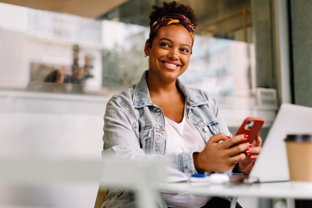 Lady on mobile phone at desk