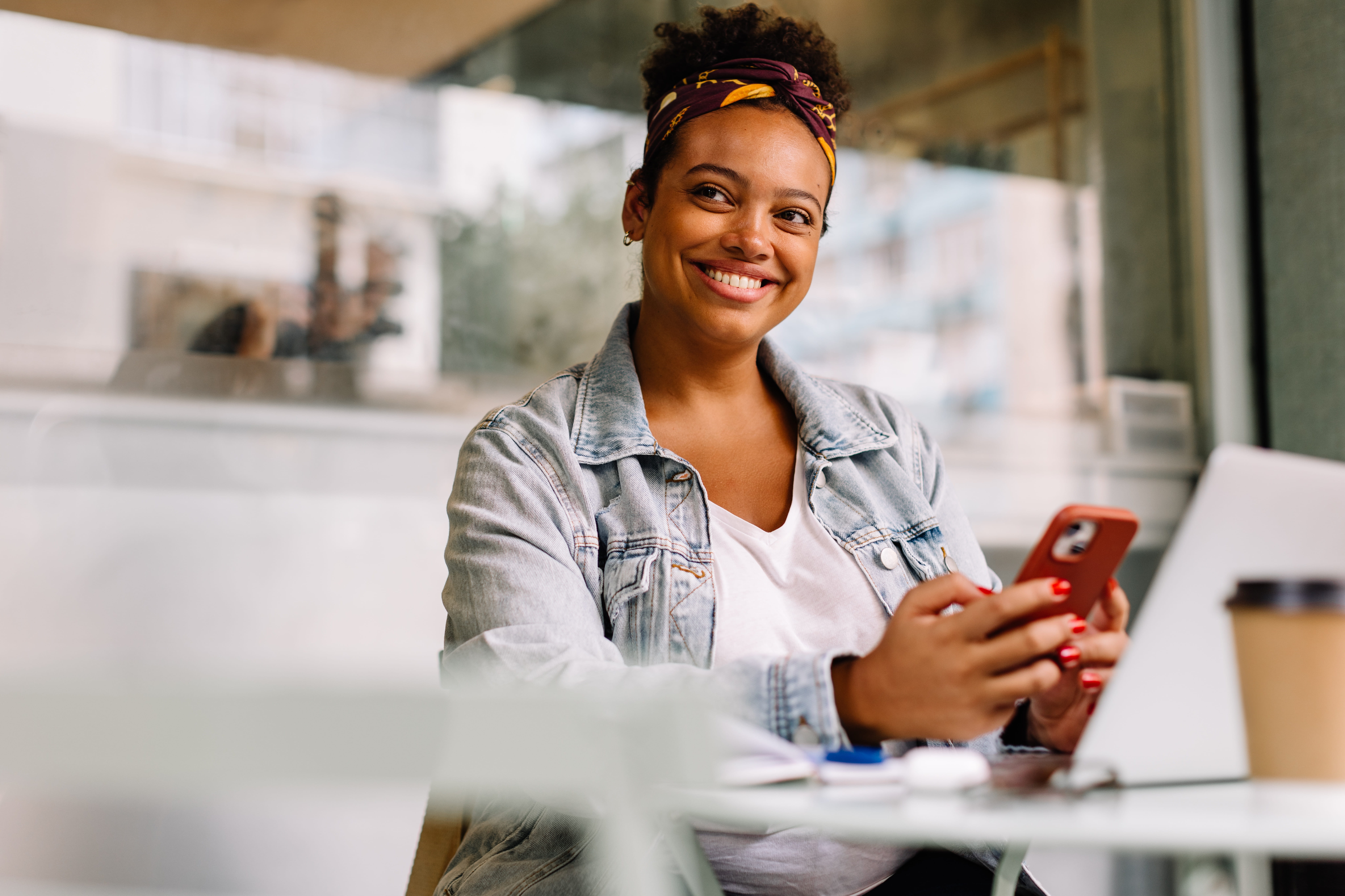 Lady on mobile phone at desk