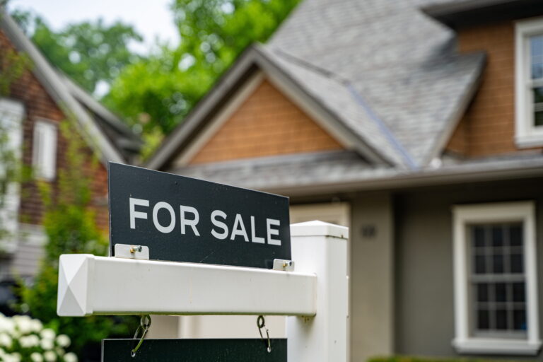 For sale sign outside of house