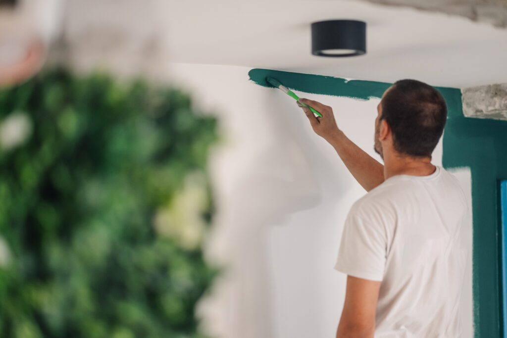 Man painting house