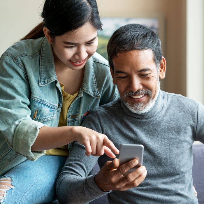 Couple looking at phone together