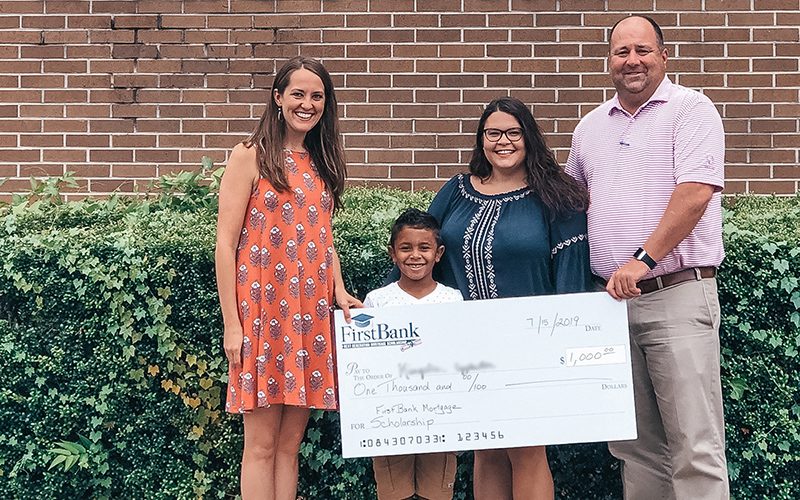 USDA_MoreThanJustLoans-final Loan officer presenting check to NextGeneration Scholarship recipient